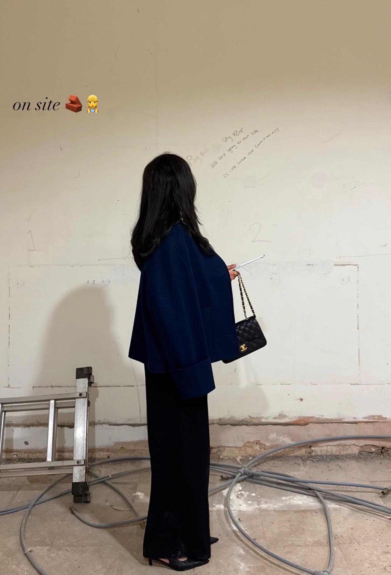 Bare shell walls with contractor notes scribbled on them, early in the 'FIA renovation